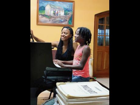 Nina Howe engages 13-year-old student Rihanna Hinds in a face-to-face session. 
