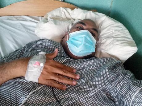 Edward Chin-Mook while he was admitted at the National Chest Hospital. He has urged everyone to invest in an oximeter to check blood-oxygen levels.