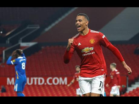 Manchester United's Mason Greenwood celebrates after scoring his side's second goal during their English Premier League match against Brighton and Hove Albion at Old Trafford, Manchester, England on Sunday.