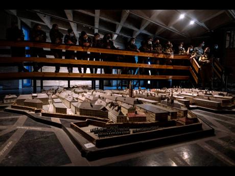 Israeli soldiers look at a model of the Warsaw Ghetto at the museum ‘From Holocaust to Revival’ on the eve of Holocaust Remembrance Day in Kibbutz Yad Mordechai, Israel, on Wednesday, April 7.