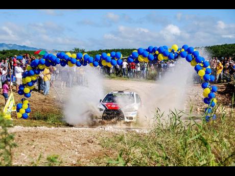 
Jeffery Panton exits the water splash of Rally Jamaica 2011 in an EvoX.