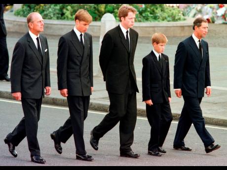 From left: Britain's Prince Philip, Prince William, Earl Spencer, Prince Harry and Prince Charles walk outside Westminster Abbey during the funeral procession for Diana, Princess of Wales on September 6, 1997.