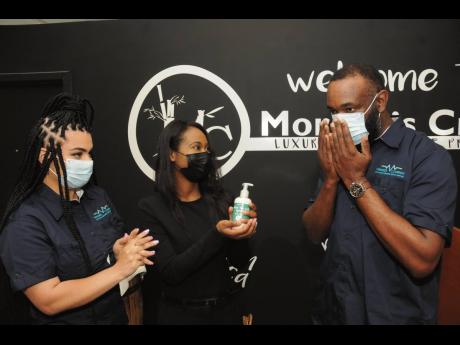 Virtudes co-founder and Chief Operating Officer Farrah Zargaran (left) and Morgan’s Creek CEO Joni-Dale Morgan observe the reaction of Virtudes Chairman and CEO Jamiel Jamieson as he tests the hemp-based lotion manufactured by Morgan’s Creek, on Thursd