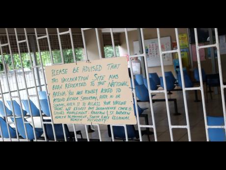 A close-up of the handwritten sign posted on the grill of the Edna Manley Health Centre at Grants Pen, advising those who turned up for COVID-19 vaccinations on Saturday, April 10, that the venue had been moved to the National Arena.