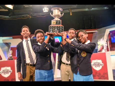 From left: Kaif Bailey, Chaunté Blackwood, Dauntae Wright, and captain Kelsi Grant hold the TVJ Schools’ Challenge Quiz trophy. They defeated Wolmer’s High School for Boys in a match that went to the wires and had to be decided by a review by the judg