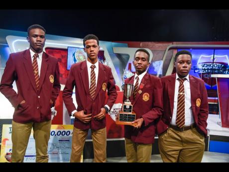 The team from Wolmer’s High School for Boys, from left: Jerome Brooks, Raheem Spencer, captain Zaire Pinto, and Chevaughn Falkner with the runners-up trophy of TVJ Schools’ Challenge Quiz.