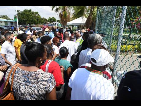 A crowd swarms the gate of St Joseph’s Hospital in Kingston waiting to get the COVID-19 jab during the vaccination blitz on Monday.
