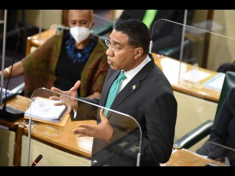 Prime Minister Andrew Holness addresses Parliament on Thursday, March 18. Holness railed against unnamed persons for peddling misinformation.