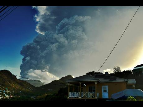 Ash rises into the air as La Soufrière volcano erupts on the eastern Caribbean island of St Vincent on Tuesday.