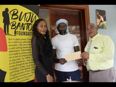 From left: Rosemary Duncan, director, Buju Banton Foundation; reggae and dancehall icon Buju Banton and Patrick Newman, director, Mount Olivet Boys’ Home.