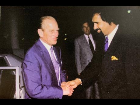 Prince Philip is welcomed by Chandi Jayawardena, general manager at the Le Meridien Jamaica Pegasus Hotel. Prince Philip visited Jamaica in 1998.