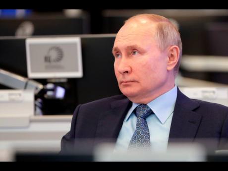 Russian President Vladimir Putin visits the Coordination Center of the Russian Government in Moscow, Russia, on Tuesday. 