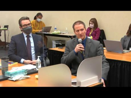 In this image from video, defence attorney Eric Nelson (left) and defendant, former Minneapolis police officer Derek Chauvin, address Hennepin County Judge Peter Cahill during motions before the court yesterday in the trial of Chauvin, at the Hennepin Cou