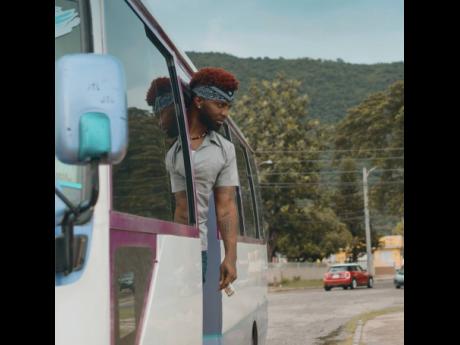 Konshens plays the quintessential ‘ducta – in uniform with a kerchief tied around his head.