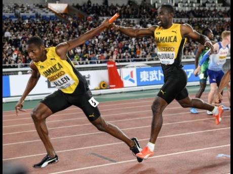 Jamaica’s Nathon Allen (left) receives the baton from Rusheen McDonald in the men’s 4x400m relay at the World Athletics Relay Championships in Yokohama, Japan on Sunday, May 5, 2019.