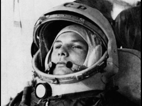 In this undated file photo, Soviet cosmonaut Major Yuri Gagarin, first man to orbit the earth, is shown in his space suit. 