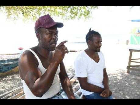 David Bowen and Khavel Dixon, residents of Grants Pen, St Thomas, discuss concerns about that the Southern Coastal Highway Improvement Project could cause their community to be forgotten. 