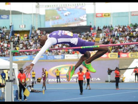 Kingston College’s Blaine Byam clears 2m to win the Class Two Boys High jump event at the ISSA/GraceKennedy Boys and Girls’ Athletics Championships at the National Stadium in Kingston on Saturday, March 30, 2019.