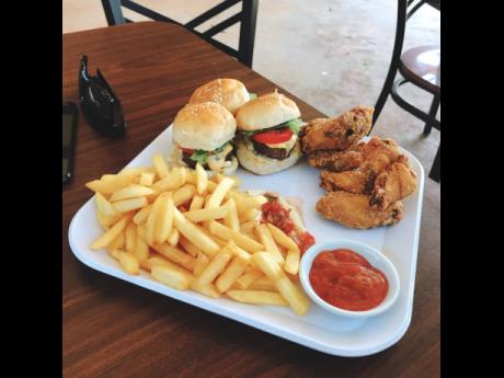 Want a quick bite but can’t choose between two loves? Blue Mahoe Estate Café has you covered! Order the burger sliders with fried wings and a serving of fries. 