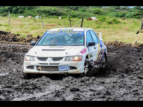 Dave Lee and his Spot Valley Mitsubishi Evo competing in the mud.