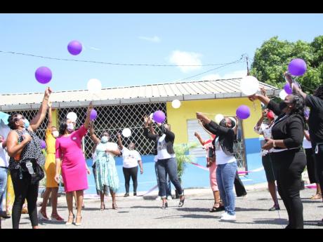 The staff of Four Paths Primary and Junior High in their final gesture of love released balloons at a remembrance service hosted by the school for Nattalie Dawkins on Thursday.