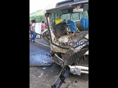 The wreckage of the Clarendon College school bus driven by Keith Dunkley. He succumbed to crash-related injuries on Wednesday.