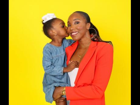 
Olympian Sherone Simpson shares a sweet moment with her four-year-old daughter, Leanna. 
