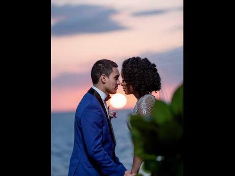 A bride and groom are seen in a romantic moment at a destination wedding coordinated by Francine Foster of Jamaica Wedding Concierge. Foster said that couples and their guests risk losing millions of dollars in event bookings.