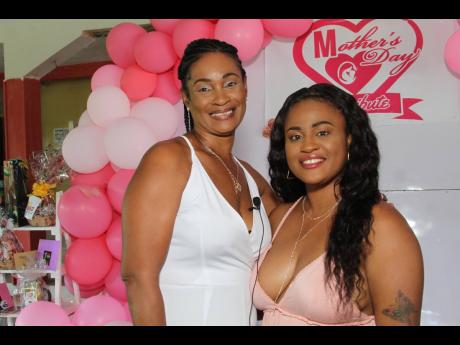 Teneash Hanna (right) and her mother Patricia Dyer were among single mothers who attended the Mother’s Day 
brunch held at Singh’s Quarry in May Pen, 
Clarendon.