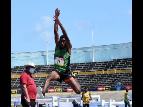 Nathan Wade from Calabar High School competes in the Class Two long jump final at the ISSA/GraceKennedy Boys and Girls’ Athletics Championships at the National Stadium yesterday. 