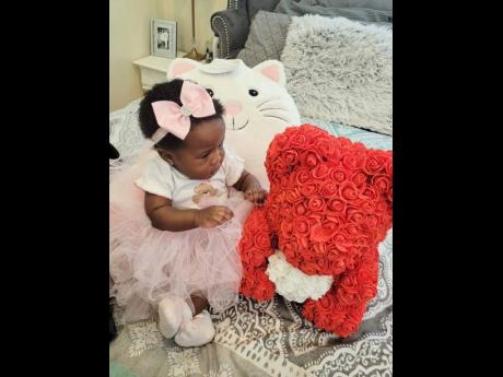 This young princess shows off her Malibrands Ja hair bow and teddy bear.