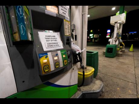 A pump at a gas station in Silver Spring, Md., is out of service, notifying customers they are out of fuel, Thursday, May 13. 