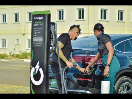 Moya-Mae Rose, Promotions Officer, Evergo, facilitates a demonstration with Nick Lue, car enthusiast, on how to use Evergo’s Level 2 Charging Station. Evergo’s Level 2 charger is compatible with both Battery Electric Vehicles (BEVs) and Plug-in Hybrid 