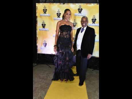 Dancehall artiste D’Angel dazzles in black alongside IRAWMA founder Ephraim Martin at the 39th staging of the awards last Sunday.