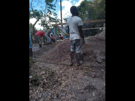 Volunteers building the foundation of the new home for Simon resident Kenneth Francis.