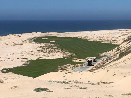 Beach sand surrounds a hole at Rancho San Lucas’ Norman Course along the Pacific Ocean in Cabo San Lucas, Mexico, on February 21, 2020. Rancho San Lucas was only open three weeks before the coronavirus pandemic shut it down, but play has started to pick 
