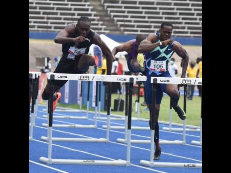 
Rasheed Broadbell (left) clears the final hurdle in the men’s 110 metres hurdles ahead of  Ronald Levy (right) during the JOA/JAAA Olympic Destiny  Series track meet at the National Stadium yesterday. Broadbell won in 13.10 seconds. 