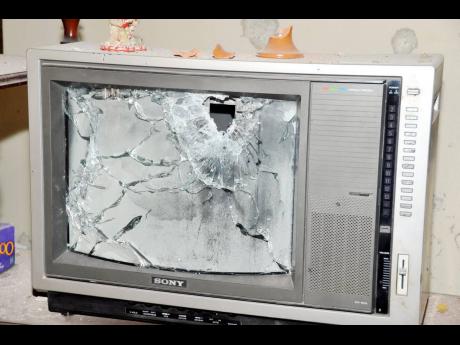 A smashed television in the Clarke’s home.