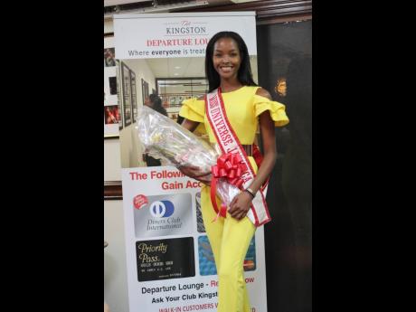 Miss Universe Jamaica Miqueal-Symone Williams arrives at the Normal Manley International Airport in Kingston last Thursday after competing at the 69th Miss Universe pageant, which was held at the Seminole Hard Rock Hotel & Casino in Hollywood, Florida, on 