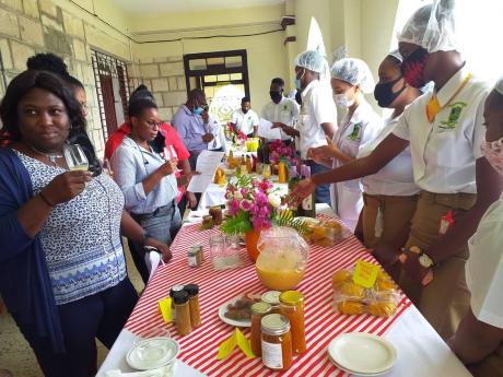 The judges and special guests sample the products manufactured by second-year students at the Knockalva Polytechnic College 
in Hanover. The students are pursuing their associate degree in agro-processing and business management. 
