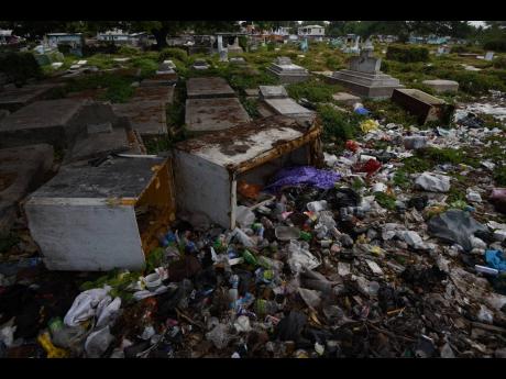Discarded appliances are among the debris that now chokes the No. 5 Cemetery in Spanish Town.