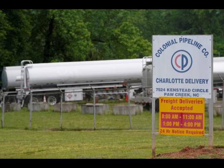 
Tanker trucks are parked near the entrance of Colonial Pipeline Company on Wednesday, May 12, 2021, in Charlotte, North Carolina. The American company reportedly paid a US$5 million ransom to hackers, who had taken control of its computer systems.