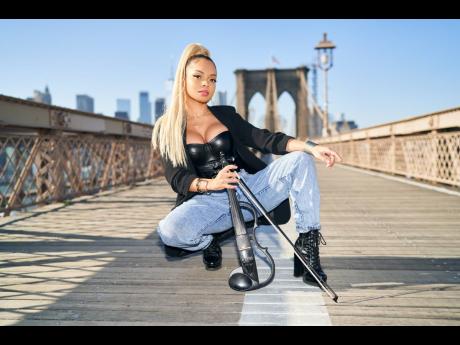 Volinist Mapy commands the same attention on stage as she does in the middle of the Brooklyn Bridge, posing for US-based photographer Rious.