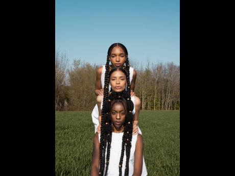 From back: Chloe Etienne, Sofia Coupellier and Aalyiah Heath wear hairstyles courtesy of Barbara Okerenta.
