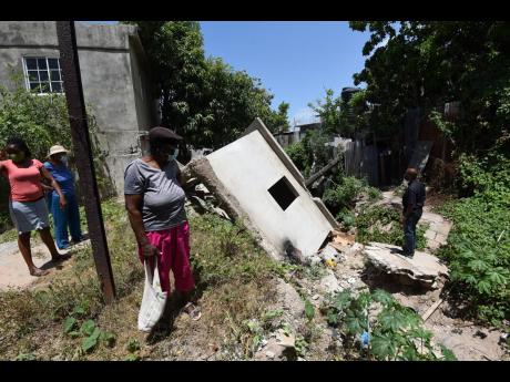 A structure which collapsed during heavy rains last year into the poorly constructed gully behind houses along Harbour Drive in Harbour View, St Andrew.