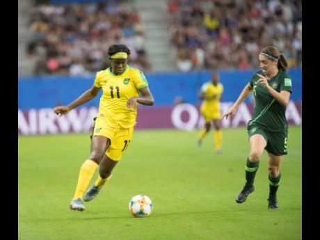 
Khadija Shaw (left) dribbles to goal, chased by Australia’s defender Karly Roestbakken in  the Jamaica vs Australia fixture of the FIFA Women’s World Cup 2019 at Stade des Alpes in Grenoble, France, on Tuesday June 18, 2019. 