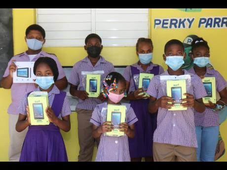 Some students of Bogue Hill Primary and Infant school who received tablets, courtesy of the custos of St James and National Pen Jamaica in Montego Bay.