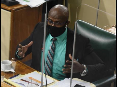 Clarendon Norther Member of Parliament Dwight Sibblies participates in a meeting of Parliament’s Public Accounts Committee in Gordon House on May 25.