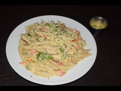 The Creamy Shrimp Alfredo Penne Pasta, served with a special ‘bun fire’ and a garlic aioli sauce.