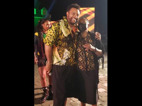 Dressed for the ‘Jimmy Kimmel Live!’ performance, entertainer Shaggy (left), embraces  Minister of Culture, Gender, Entertainment and Sport Olivia Grange. 